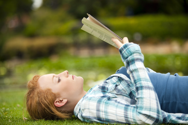 bigstock-Young-woman-sitting-outside-re-15704084-1